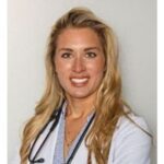 Bryn Renda, PA-C, of Axis Stem Cell Institute in a white coat and stethoscope